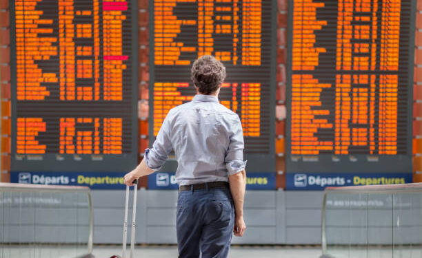 travel with international flight, person passenger waiting in airport departure terminal